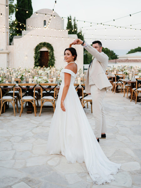 Bride twirling during reception at Anassa Hotel Cyprus wedding.