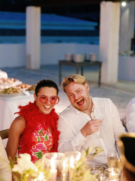 Guests laughing at candlelit reception at Anassa Hotel Cyprus.