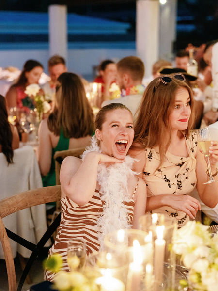 Wedding guests reacting during speech at Anassa Hotel Cyprus reception.
