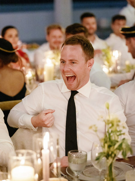 Guest laughing during reception speech at Anassa Hotel Cyprus.