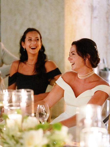Bride smiling during candlelit reception at Anassa Hotel Cyprus.
