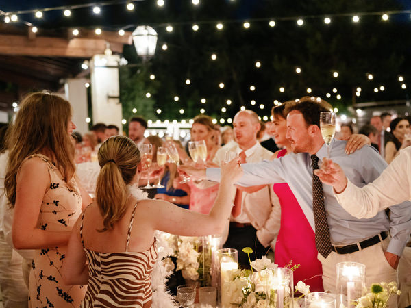 Guests toasting during reception at Anassa Hotel Cyprus wedding.