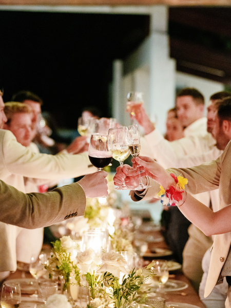 Guests clinking glasses during luxury Cyprus wedding reception.