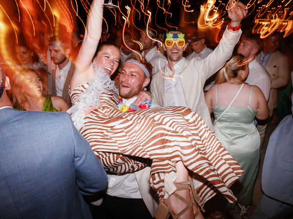 Guest lifted on dancefloor during Anassa Hotel Cyprus wedding party.