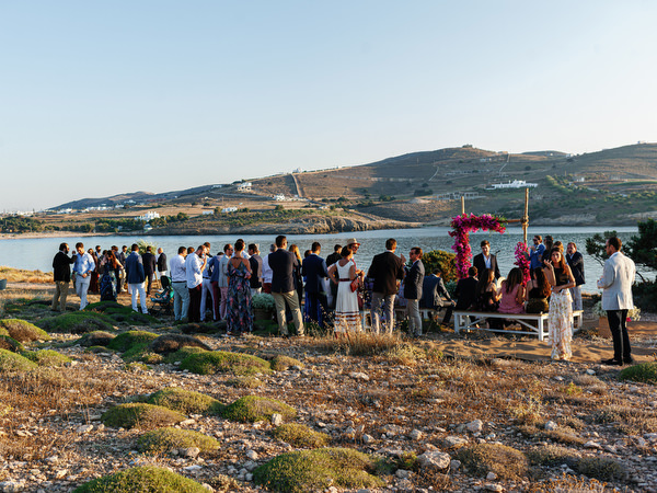 Guests gathering for cliffside ceremony in Antiparos.