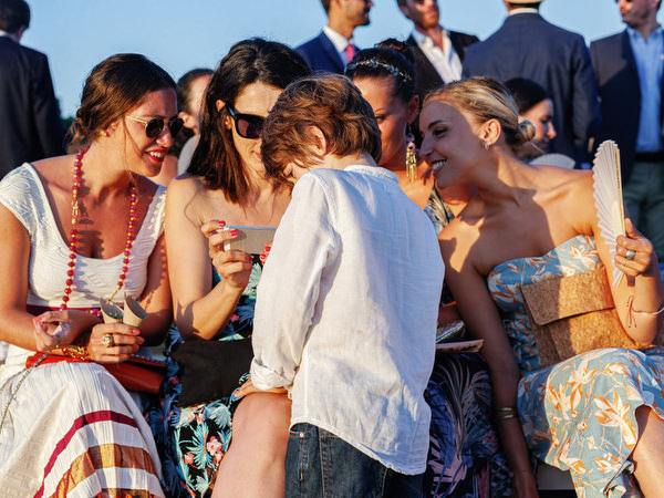 Wedding guests mingling during Antiparos ceremony.