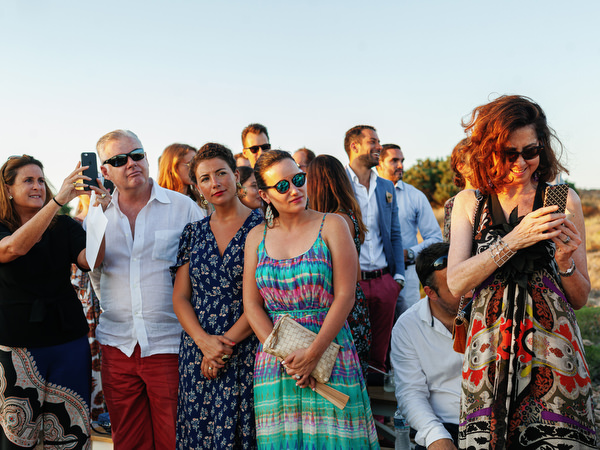 Guests seated during sunset ceremony in Antiparos, Greece.