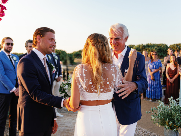Groom greeting bride during Antiparos destination wedding ceremony.