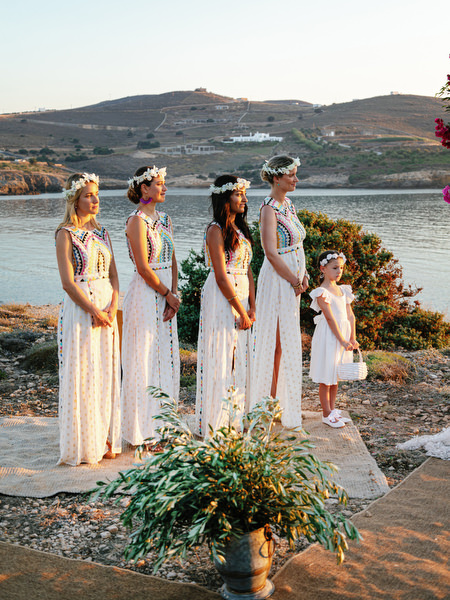 Bridesmaids lined up for Antiparos seaside wedding ceremony.