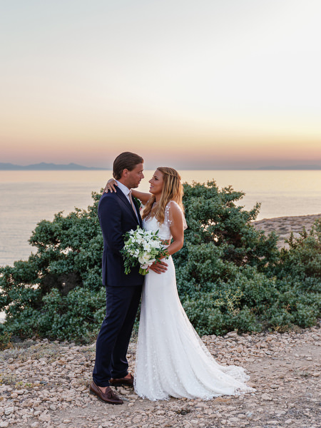 Newlyweds embracing during sunset portraits in Antiparos.