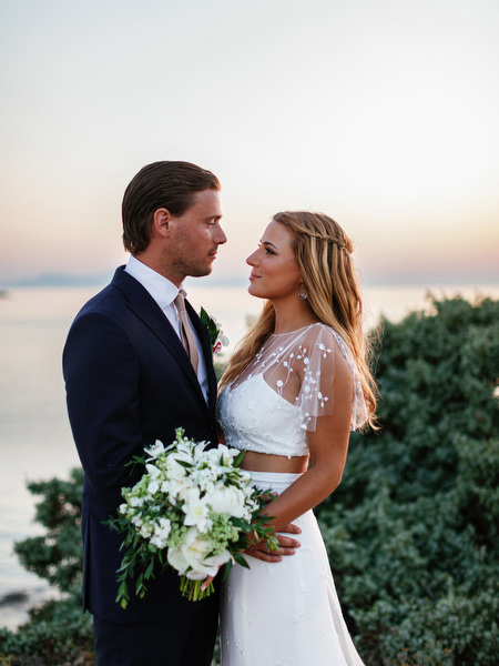 Newlyweds embracing during sunset portraits in Antiparos.