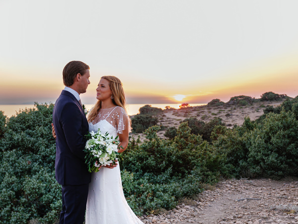 Sunset wedding portrait overlooking the Aegean Sea in Antiparos.