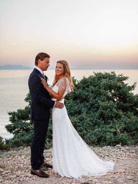 Sunset wedding portrait overlooking the Aegean Sea in Antiparos.