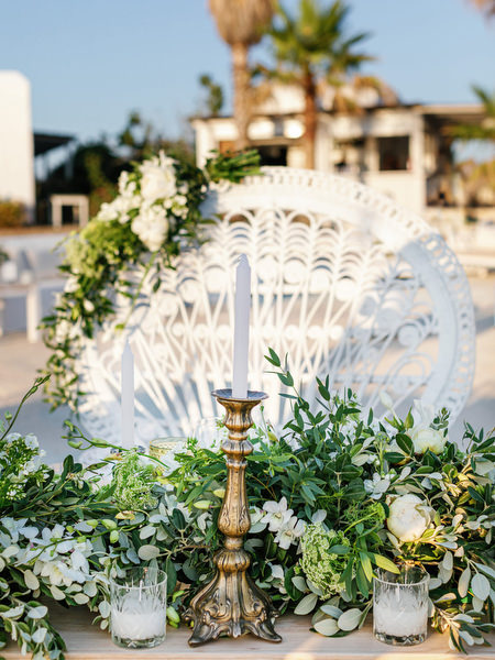 Floral sweetheart table detail at Antiparos seaside wedding reception.