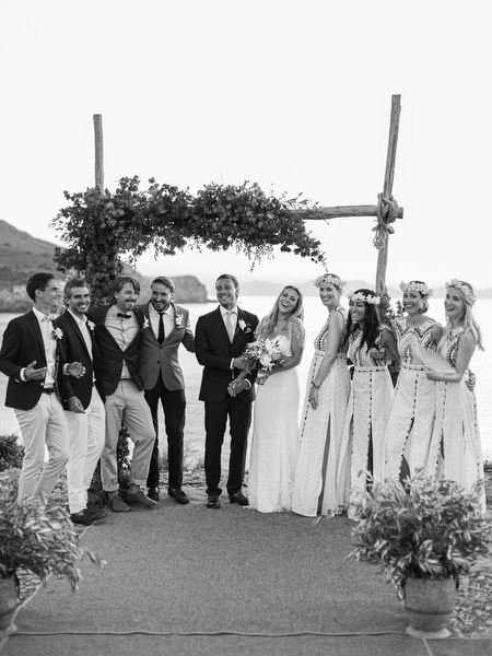 Black and white bridal party portrait at Antiparos cliffside wedding.