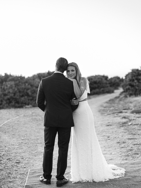 Black and white sunset portrait of bride and groom in Antiparos.