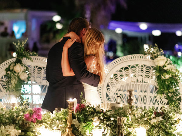 Bride and groom embracing after speeches in Antiparos.