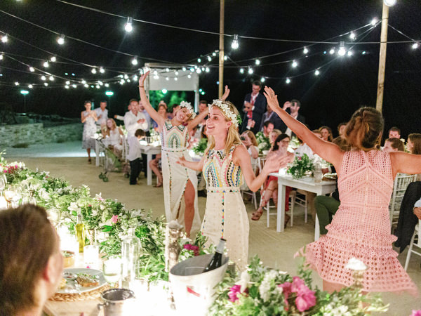 Guests cheering bride and groom at Antiparos night reception.