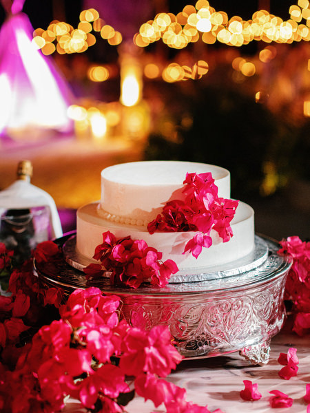 Wedding cake decorated with bougainvillea at Antiparos reception.