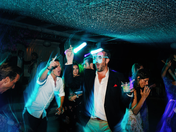 Groom’s friend dancing during Antiparos night wedding party.