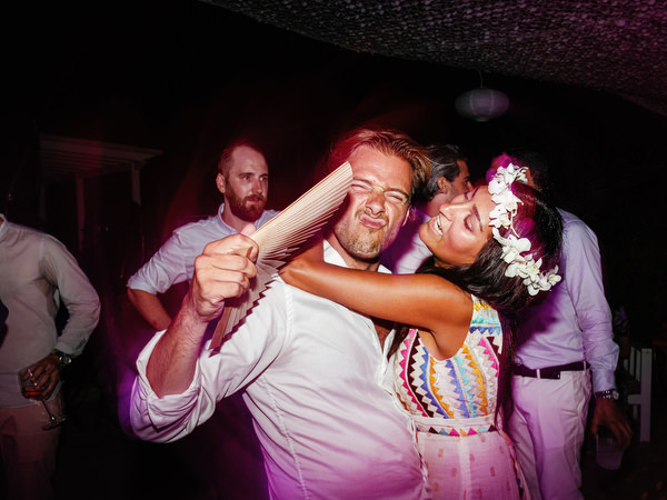Guests hugging and dancing at Antiparos wedding party.