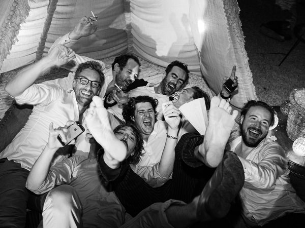 Group of friends celebrating at Antiparos night wedding.