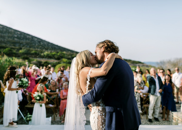 Newlyweds kissing at Villa Berenice Antiparos.