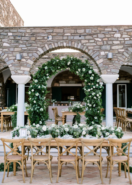 Greenery arch decor at Antiparos wedding reception.