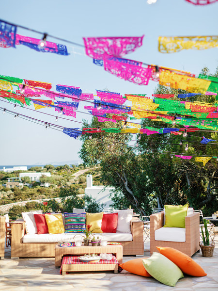 Mexican fiesta pre-wedding party in Antiparos with colorful papel picado decorations