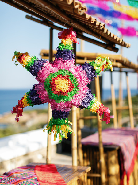 Bright fiesta decor setup for Mexican pre-wedding party in Antiparos