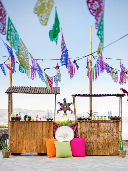 Decorated outdoor bar setup for Mexican fiesta pre-wedding celebration in Greece