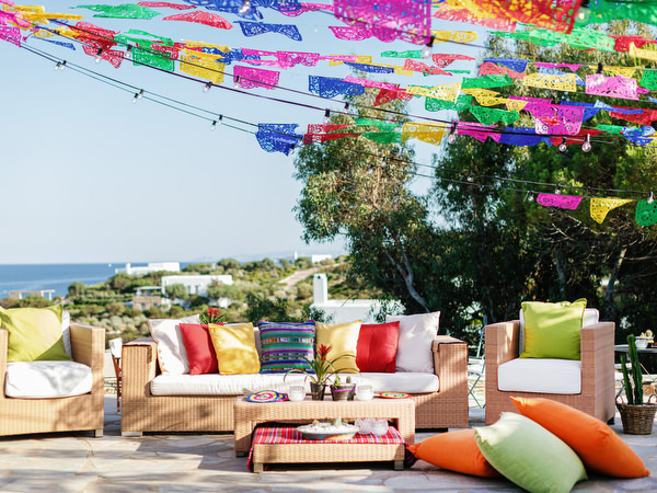 Outdoor lounge setup for Mexican fiesta pre-wedding party in Antiparos