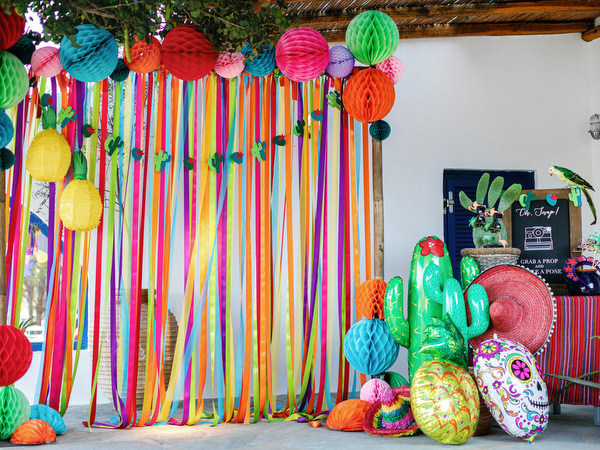 Colorful entrance decorations at Mexican fiesta pre-wedding party in Greece