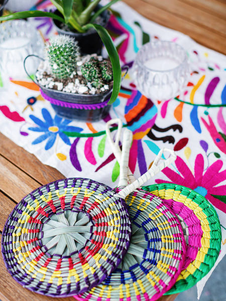 Colorful Mexican embroidery details at pre-wedding party in Greece