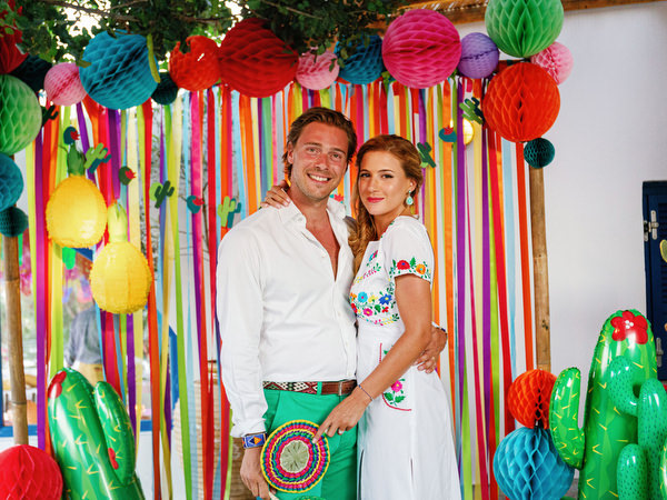 Couple posing together at Mexican fiesta pre-wedding party in Greece