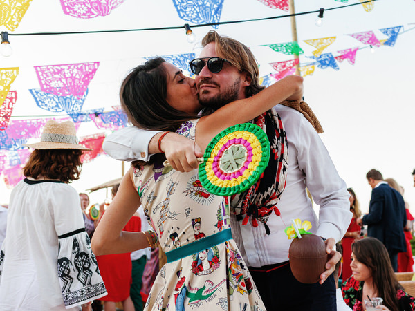 Couple embracing during Mexican fiesta pre-wedding party in Antiparos