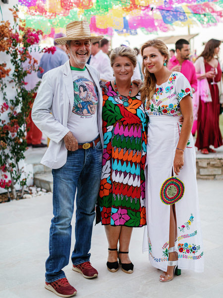 Colorful fiesta group portrait during Antiparos pre-wedding party