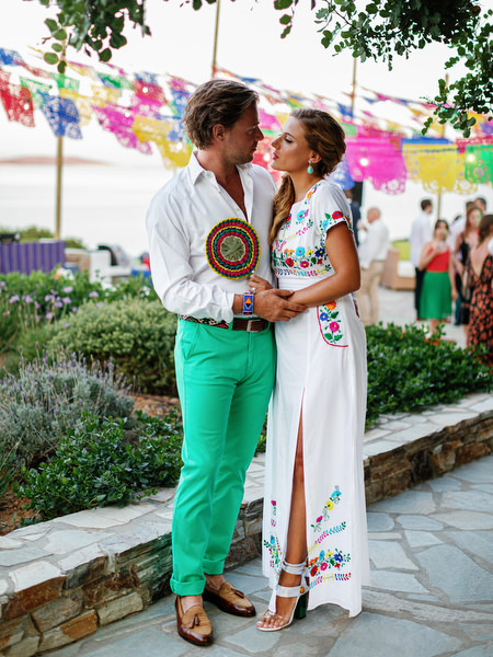 Bride and Groom dancing together at Mexican fiesta pre-wedding party