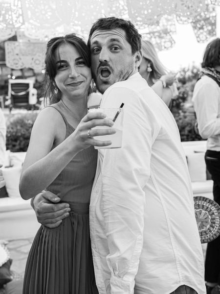 Couple dancing together at Mexican fiesta pre-wedding party