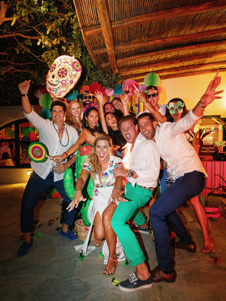 Bride posing with friends during colorful Antiparos pre-wedding celebration