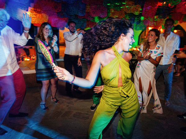 Friends dancing at Mexican fiesta pre-wedding party