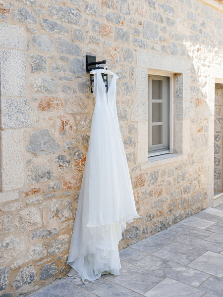 Wedding dress hanging at Aria Estate wedding venue in the Peloponnese