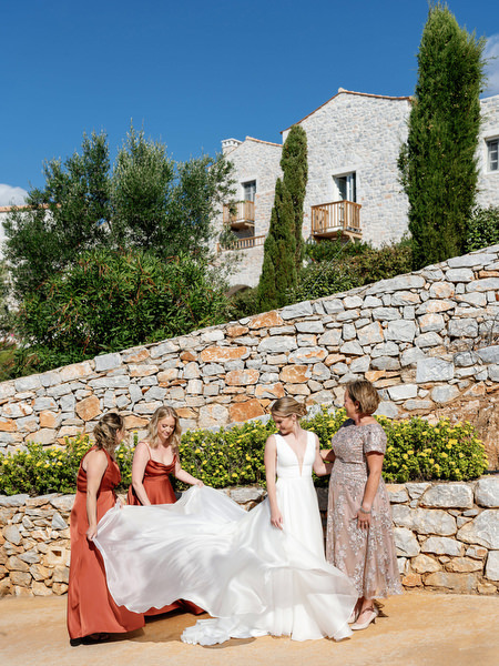 Bridesmaids helping bride at Aria Estate wedding in the Peloponnese