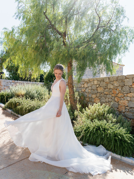 Bride twirling in flowing gown at Aria Estate in the Peloponnese