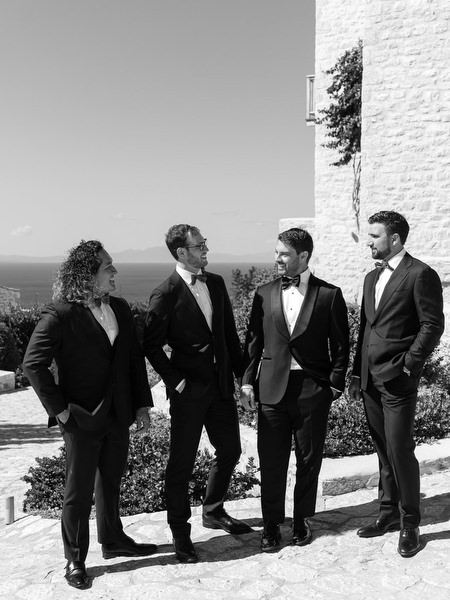 Black-and-white groomsmen portrait at Aria Estate in Greece