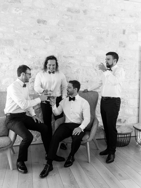Groomsmen candid moment before ceremony at Aria Estate in the Peloponnese