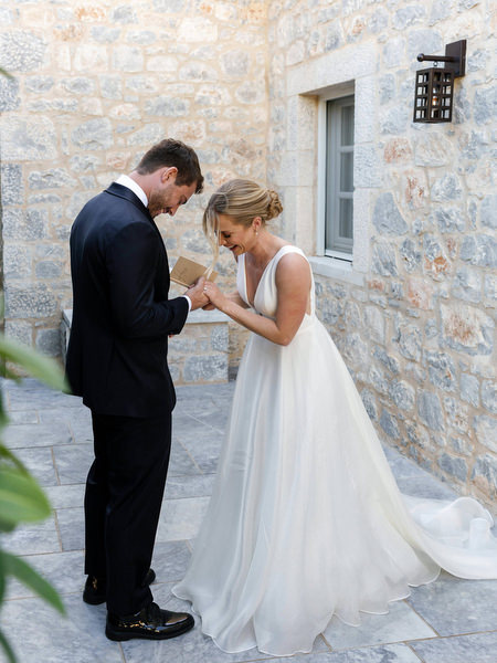 Bride and groom exchanging vows at Aria Estate in the Peloponnese