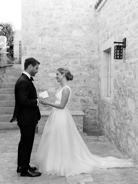 Black-and-white vow exchange at Aria Estate wedding venue
