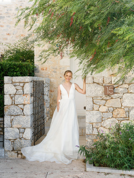 Bride portrait at Aria Estate stone courtyard in the Peloponnese