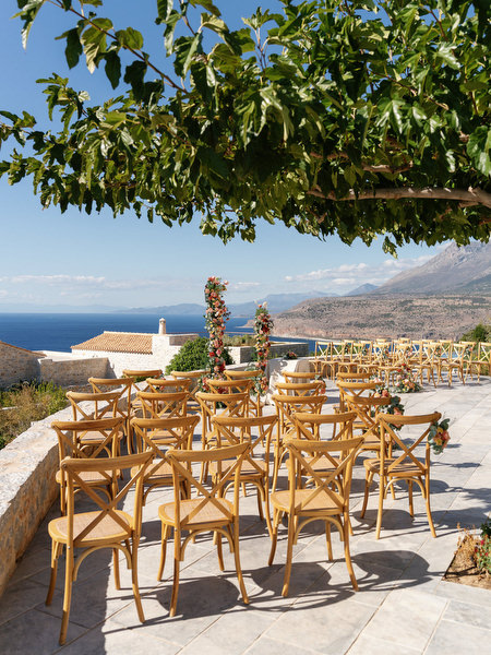 Aria Estate wedding ceremony chairs with Peloponnese mountain views